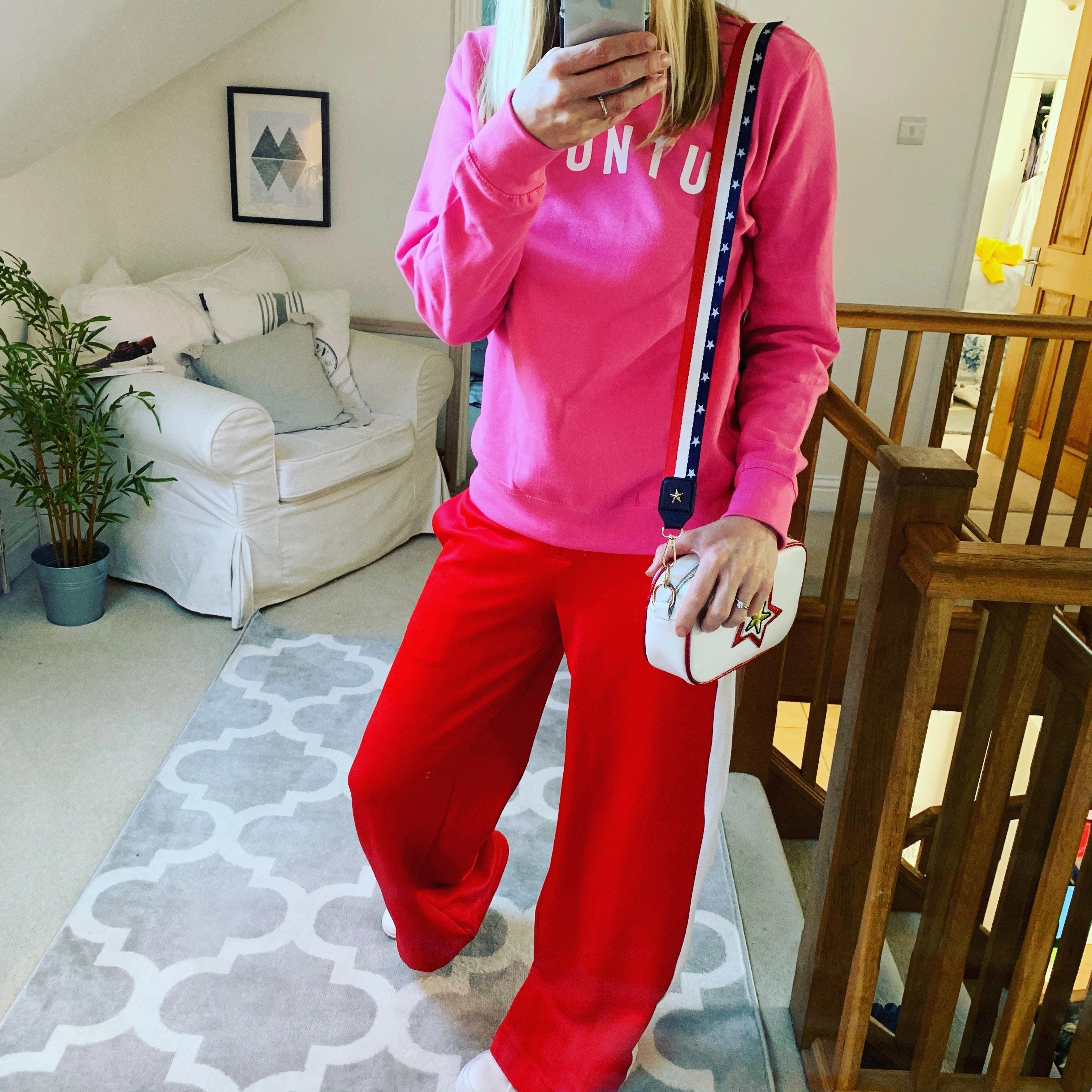 White UBUNTU on bright pink sweatshirt