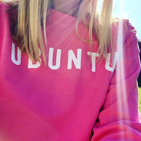 White UBUNTU on bright pink sweatshirt